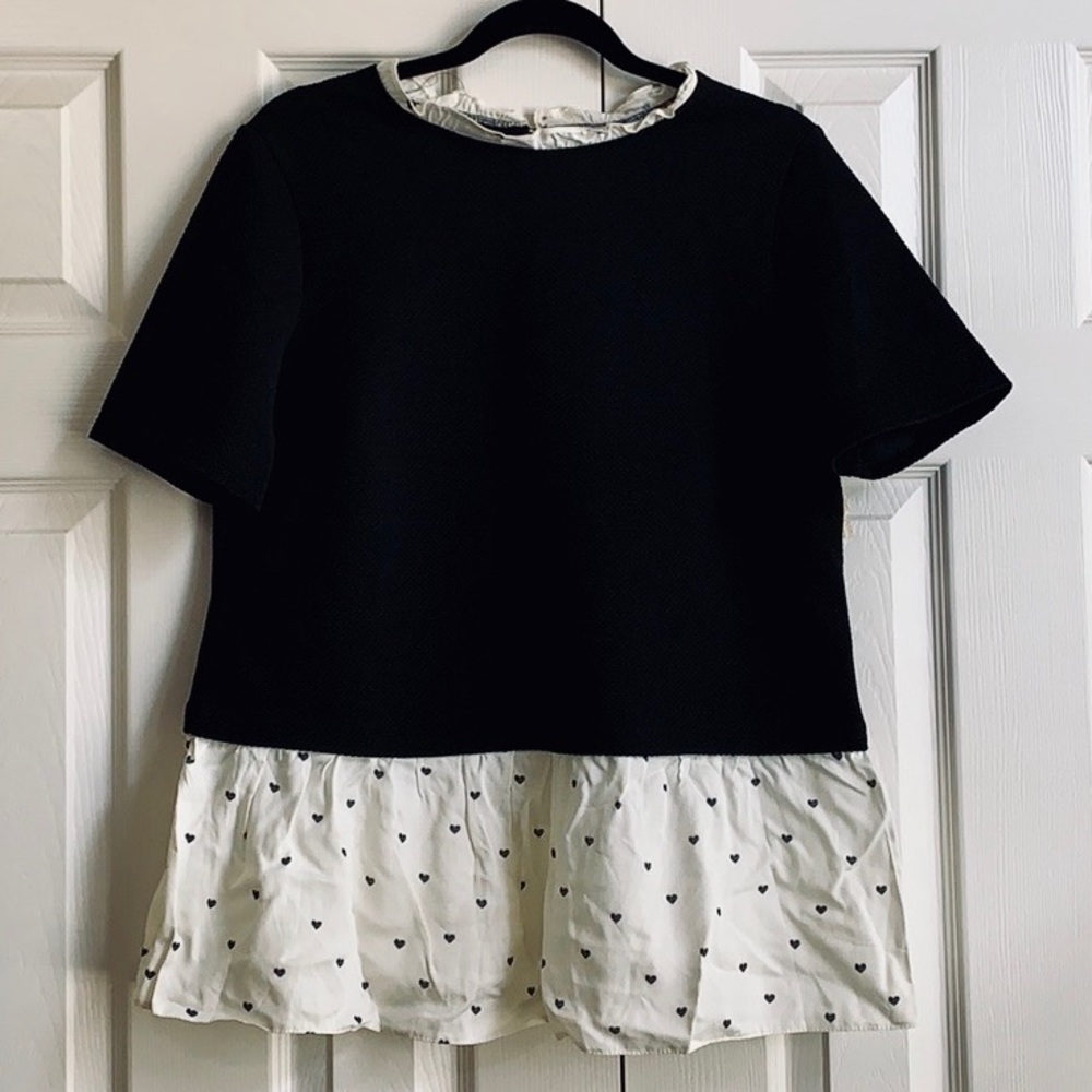NWT. Black short sleeve peplum top.